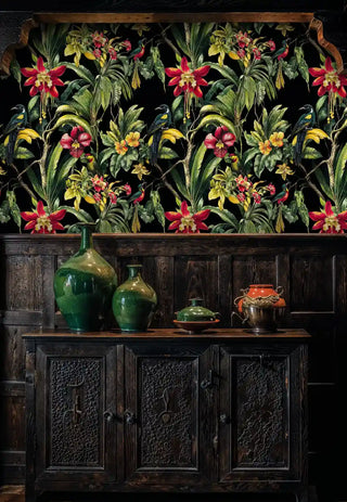 vibrant tropical botanical wallpaper with exotic birds displayed in traditional dining room with carved wooden sideboard