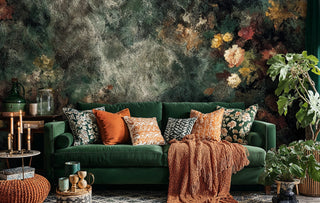 Vintage abstract floral wallpaper with weathered texture displayed in modern living room with green sofa and plants