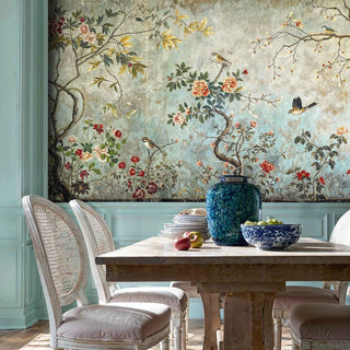Vintage botanical birds wall mural with flowering branches in country dining room with cane-back chairs