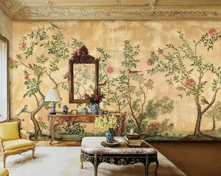Vintage Chinoiserie Wall Mural with birds and pink flowers on a gold background, in a formal room with an ornate gilded mirror.