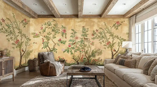 Vintage Chinoiserie Wall Mural with birds and pink flowers on a gold background, in a rustic living room with exposed wood beams.