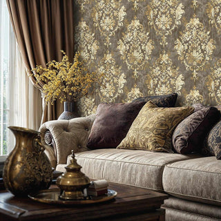 Vintage damask wallpaper with gold motifs on grey background in elegant living room with neutral sofa