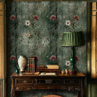 Vintage floral wallpaper with cracked texture in sage green, featuring pink blooms, shown in classic study with ornate desk