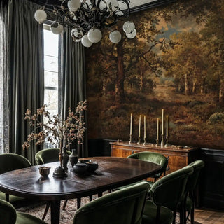 Vintage forest scene wallpaper with golden trees, shown in formal dining room with modern chandelier