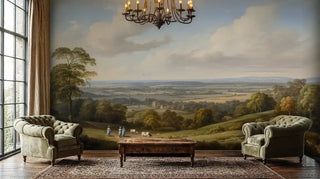 Vintage landscape wall mural creating a feature wall in a sophisticated living room with two tufted green velvet armchairs.