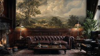 Vintage landscape wall mural featuring golden valley scene, displayed in dark study with leather furniture