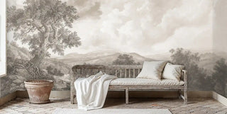 Vintage landscape wall mural featuring serene countryside view shown with rustic wooden bench and terracotta pot