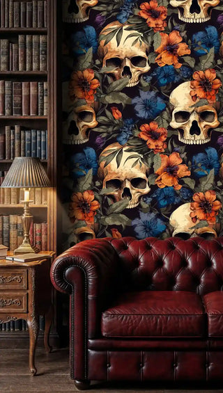Vintage skull floral wallpaper featuring orange and blue blooms in classic library with leather sofa