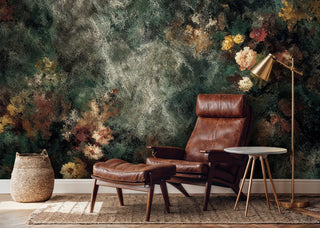 Vintage textured floral wall mural with weathered patina displayed in modern reading corner with leather chair