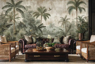 Vintage tropical wallpaper featuring herons and lush palms in muted tones, shown in colonial living room with leather sofa