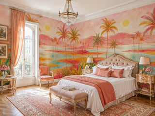 Watercolor palm tree wall mural in coral and orange tones in an elegant bedroom with crystal chandelier and tufted bed
