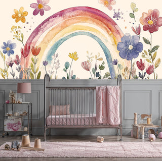 Watercolor rainbow and flower wall mural in elegant nursery with gray wainscoting and pink accents
