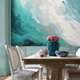 Wave pattern abstract wall mural in turquoise and beige tones, in casual dining room with blue ceramic vase