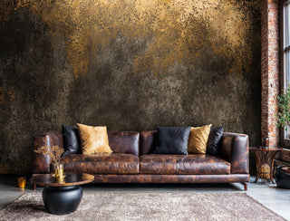 Weathered metal wall mural with patina effects in industrial loft with brown leather sofa