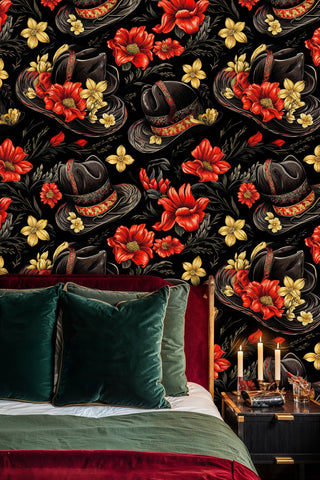 Western botanical wallpaper with detailed hats and wildflowers, displayed in bedroom with emerald velvet pillows and brass candles
