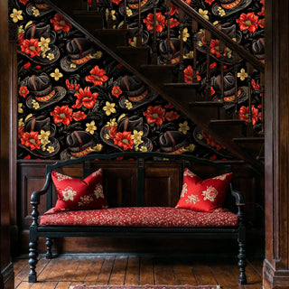 Western floral wallpaper with ornate leather hats and golden blooms, displayed under wooden staircase with red cushioned bench