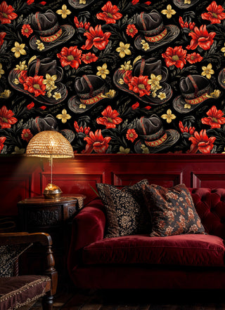 Western hat wallpaper featuring detailed cowboy hats and red wildflowers on black, shown in elegant living room with burgundy sofa