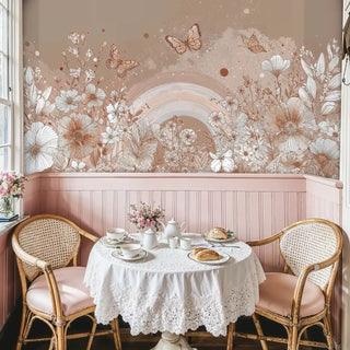 Whimsical butterfly wallpaper featuring rainbow arch and florals, displayed in charming breakfast nook with rattan chairs