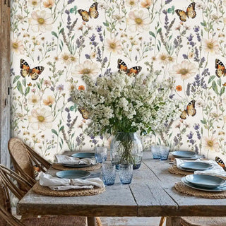 Wildflower peel and stick wallpaper with monarch butterflies, displayed in dining room with rustic wooden table setting