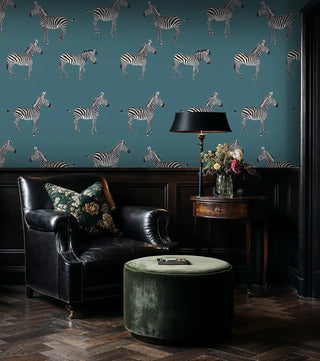 Wildlife zebra wallpaper with black and white animals, displayed in elegant living room with green velvet ottoman