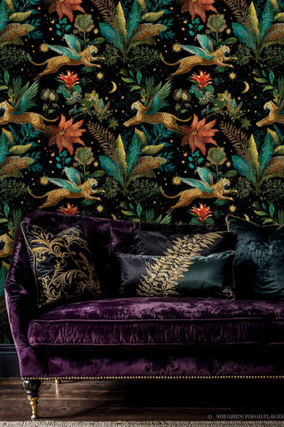 winged leopard wall mural with stars and botanical details, styled behind luxurious purple velvet sofa