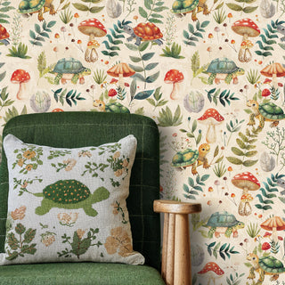 Woodland creatures wallpaper featuring turtles and red mushrooms in watercolor style, shown in cozy living room with green armchair