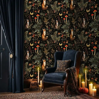 Woodland creatures wallpaper with golden stars and botanicals, shown in elegant room with navy chair