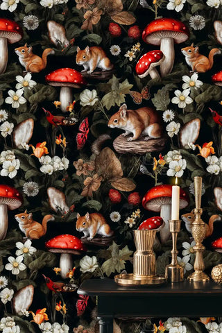 Woodland creatures wallpaper with squirrels, mushrooms, and florals on dark background, displayed with brass decor