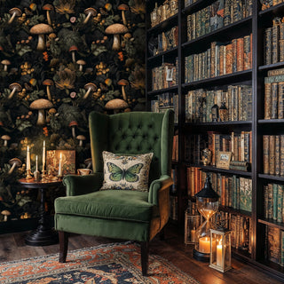 Woodland mushroom wallpaper displaying detailed fungi and berries, featured in cozy library with green velvet chair