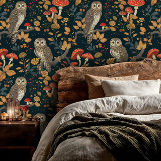 Woodland owl wallpaper featuring spotted mushrooms and golden foliage, shown in a rustic bedroom with wood headboard