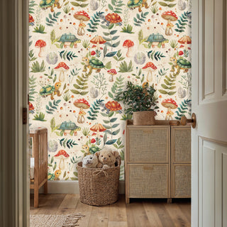 Woodland themed wallpaper showing turtles among red toadstools, in nursery setting with wicker storage basket